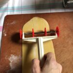 cutting the pasta with a roller with zigzag edges