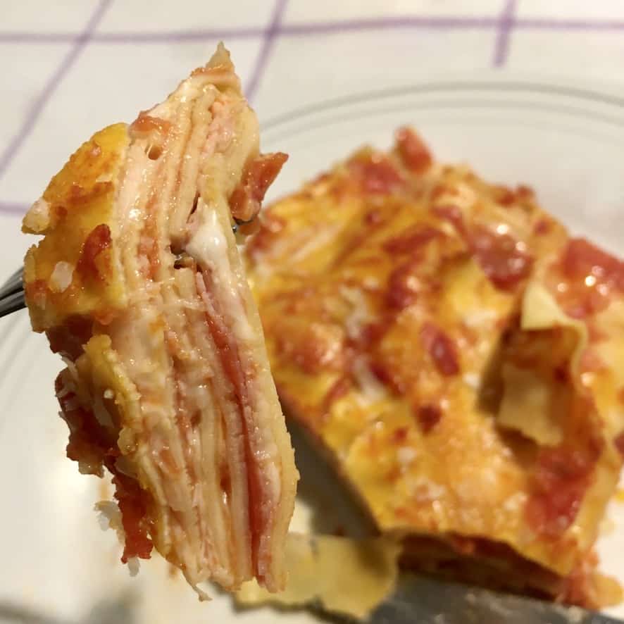 a fork full of Anna's lasagna showing the impossibly thin layers and the simplicity of the lasagna