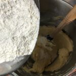 adding flour to the creamed mixtures