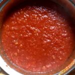 deep bright red homemade tomato sauce with extra virgin olive oil, La Giara Pera d'Abruzzo tomato passata, onions, carrot, and garlic.