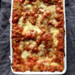 Perfectly golden brown and cheesy tomato and prosciutto cotto lasagna (Italian cooked ham and tomato sauce lasagna)