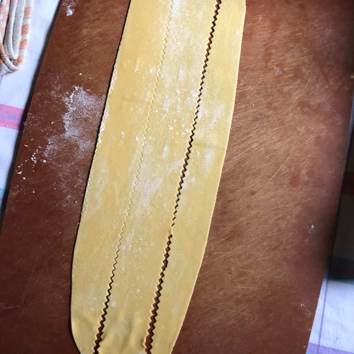 Long wide ribbons of handcut homemade pappardelle egg pasta.