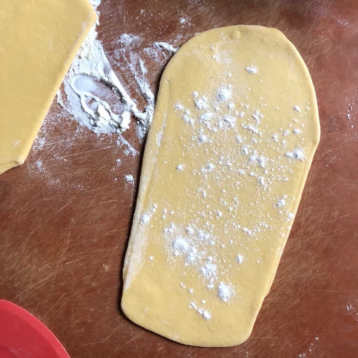 Semolina and 00 flour pasta dough rolled on the widest setting of the pasta machine, 00 flour and semolina pasta recipe first pass.