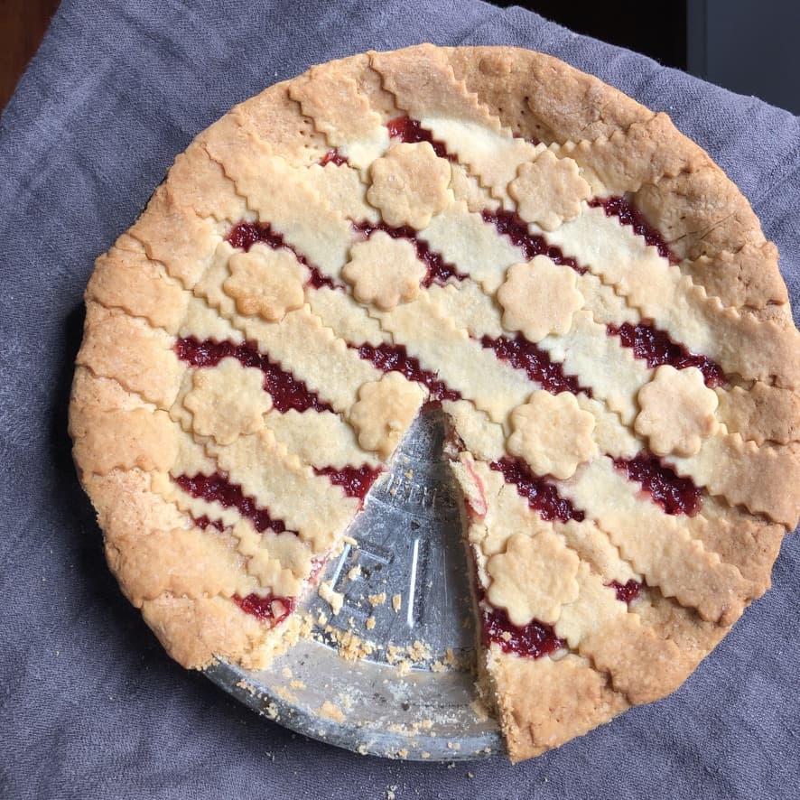 Fully baked golden brown strawberry crostata fresh from the oven