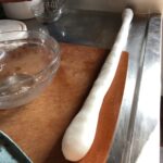 a har gow dumpling dough log that's3 times the length of the first one