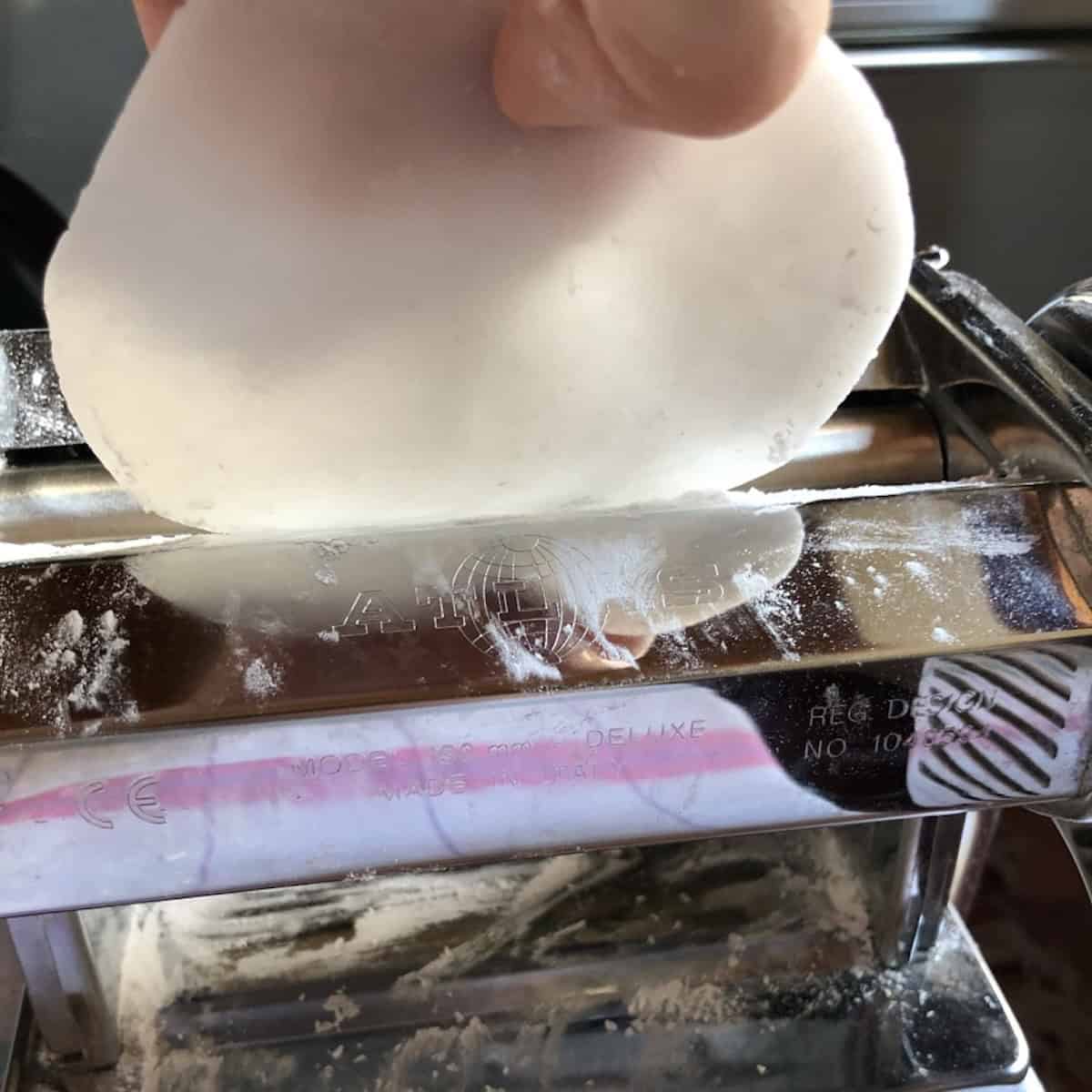 Har gow wrapper dough flattened after being fed through the pasta machine on settings two, three, and four showing the wrapper getting progressively thinner.
