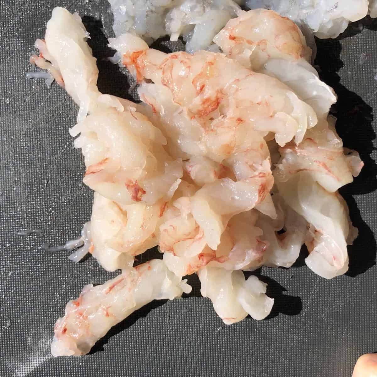 Soaked and drained shrimp patted completely dry and ready to chop for har gow.
