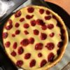 Strawberry cheesecake dotted with homemade strawberry jam dotting the top and baked in