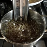 a candy thermometer in the hot syrup