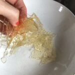 bloomed gelatin in a bowl with the water squeezed out