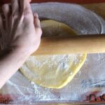 rolling out the dough with a rolling pin