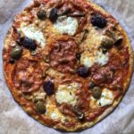 A beautiful super crispy thin crust 00 flour pizza with spicy Ventricina slices, olives, shallots, and fresh mozzarella, and buffalo mozzarella.