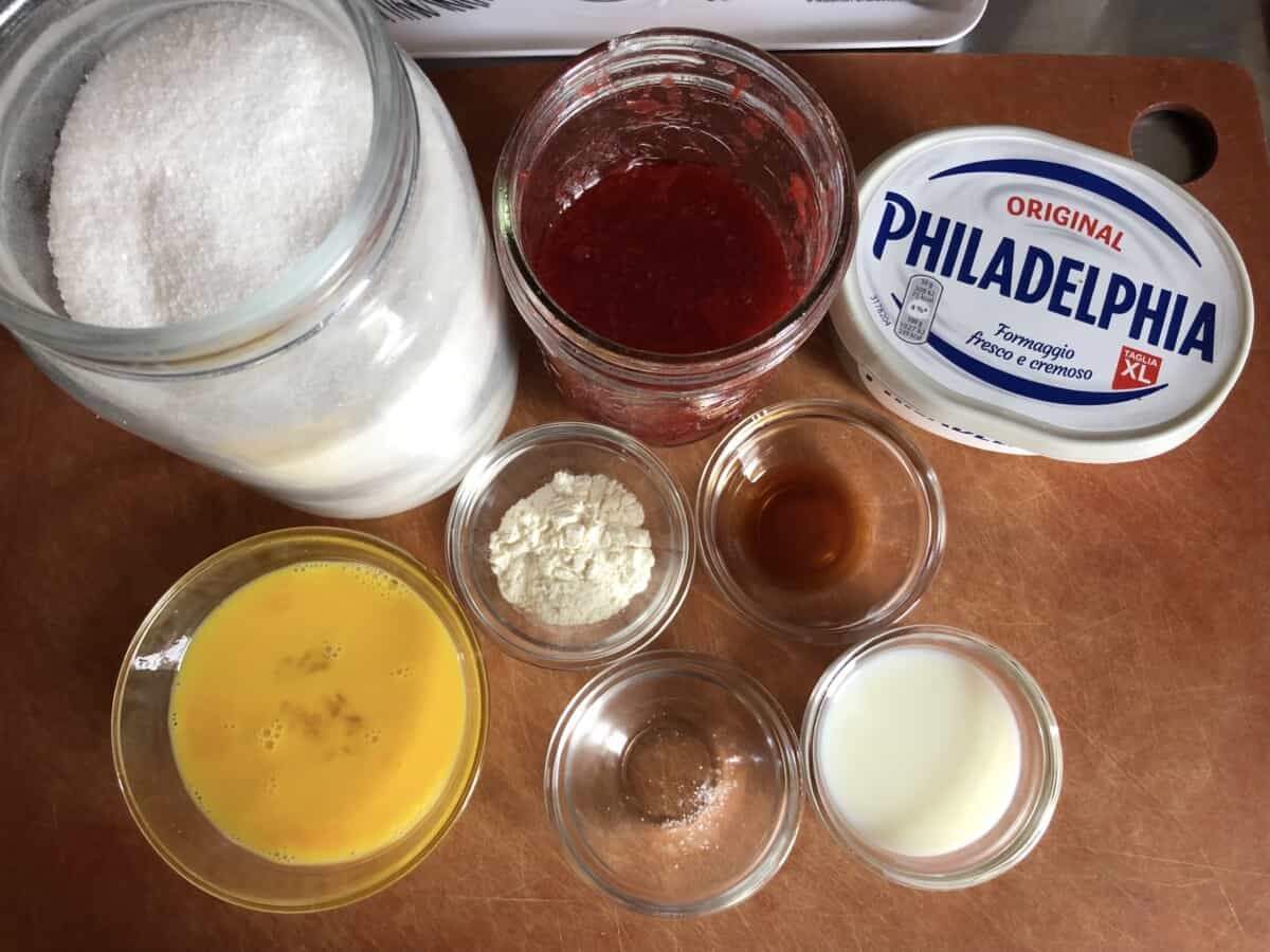 strawberry cheesecake base ingredients on a cutting board