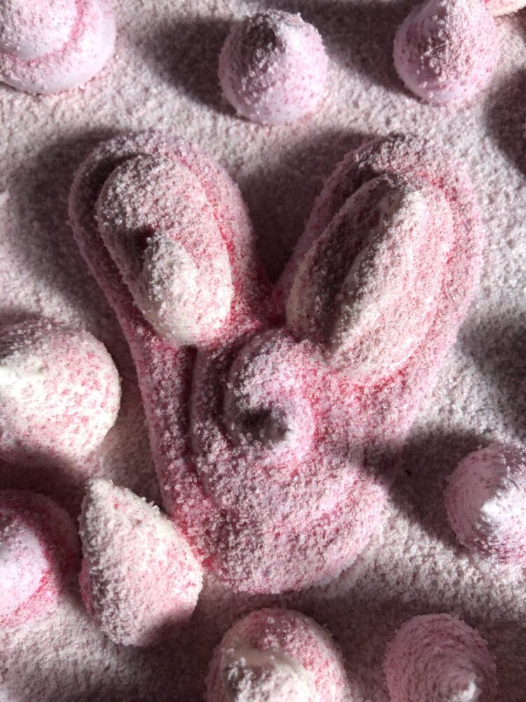 pink with pink-dusted marshmallows "drops" surrounding a pink marshmallow bunny head in the middle