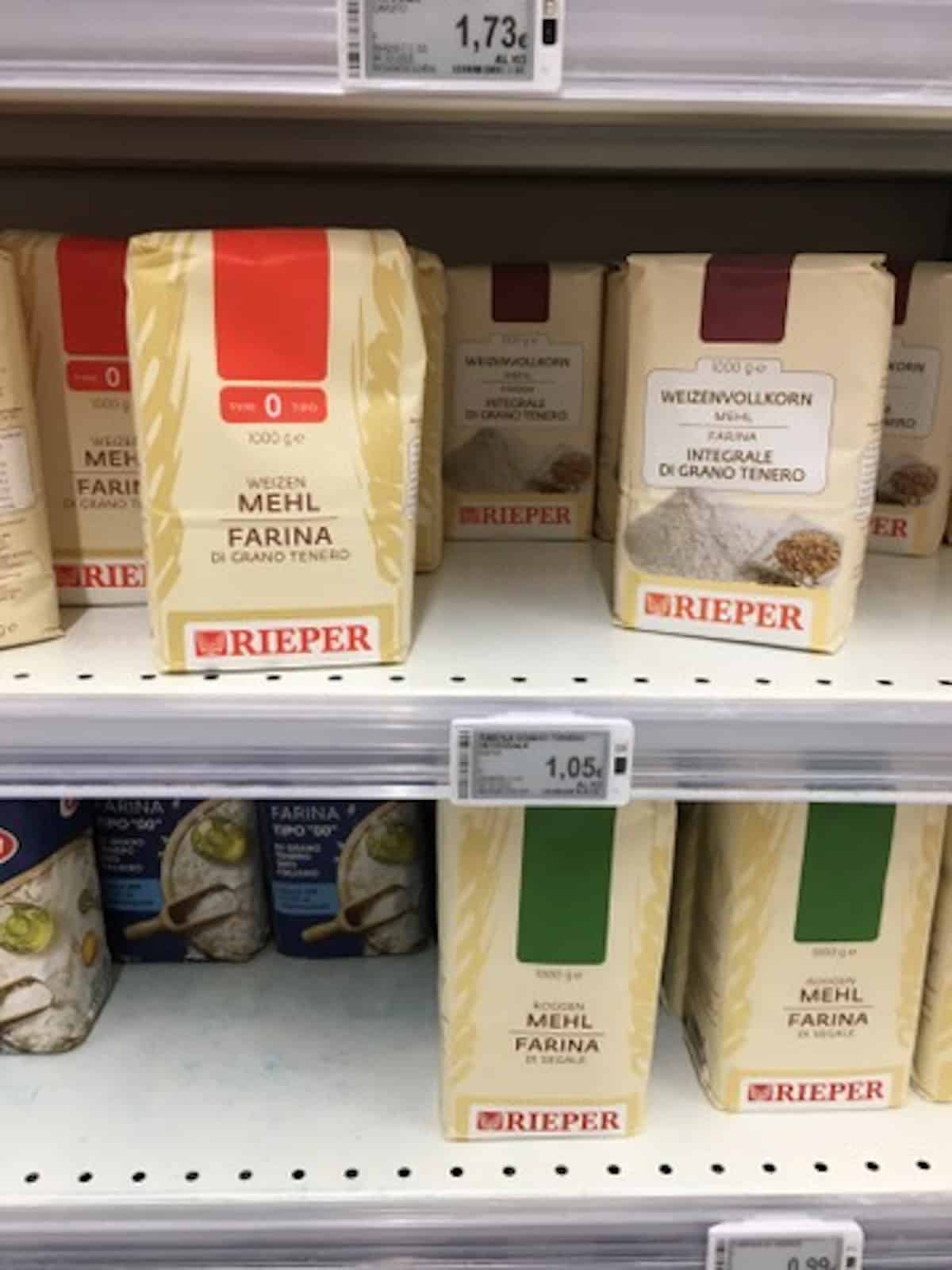Italian whole wheat flour (farina integrale) on the shelf at our local Italian grocery store.