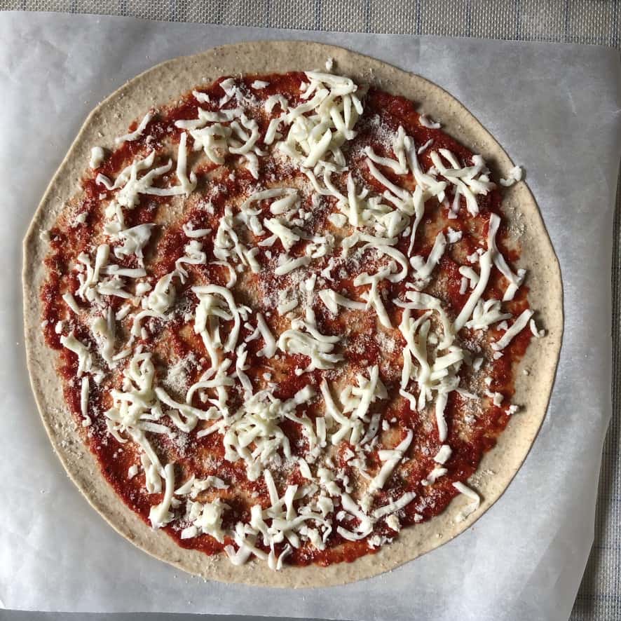 Mozzarella added to the pizza dough.
