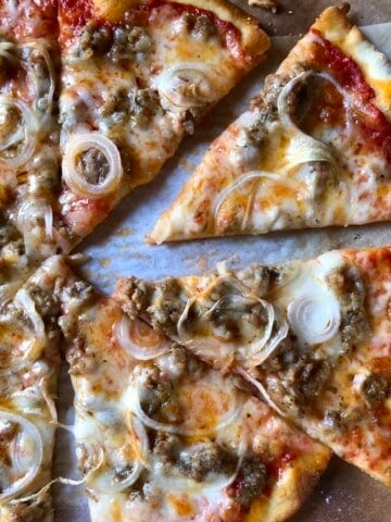 Pizza dough recipe for a homemade pizza with sausage and onion on a crispy bread flour pizza crust recipe, how to make pizza dough for the best homemade pizza dough.