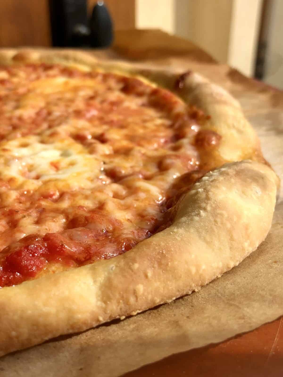 thick crust pizza recipe using 00 flour baked till golden brown with a perfectly puffy pizza crust (corniche).