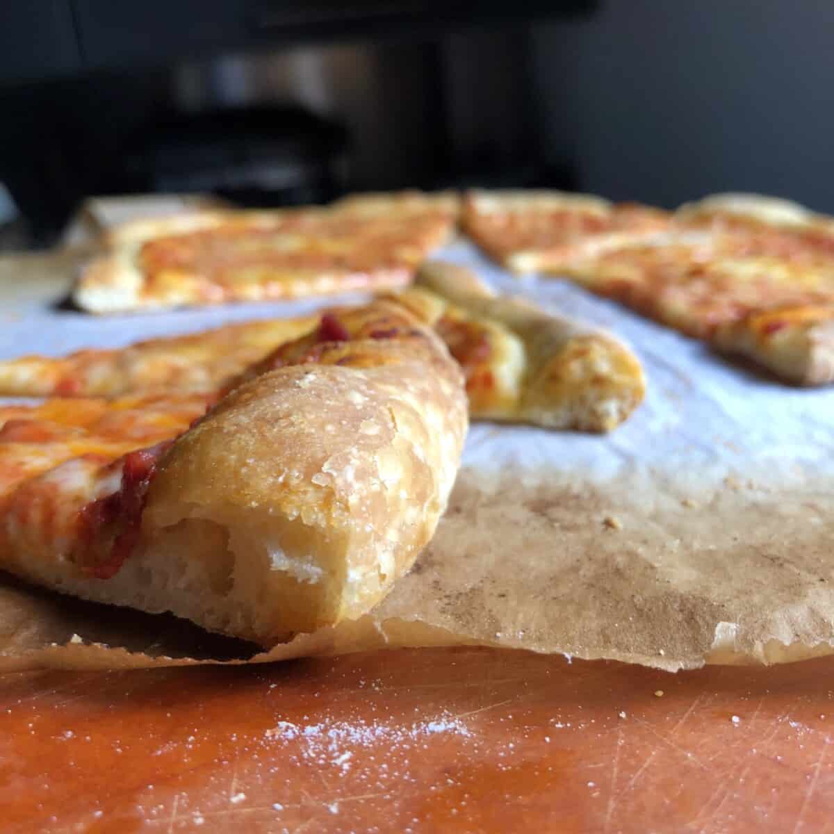 View of pizza crust from the side.
