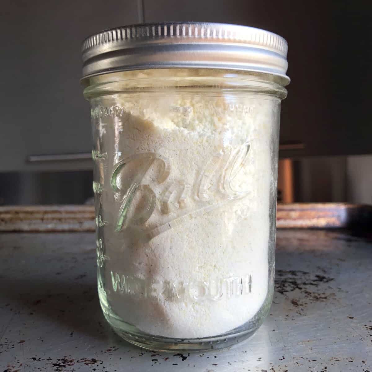 A sealed mason jar with vanilla pudding recipe (no eggs).