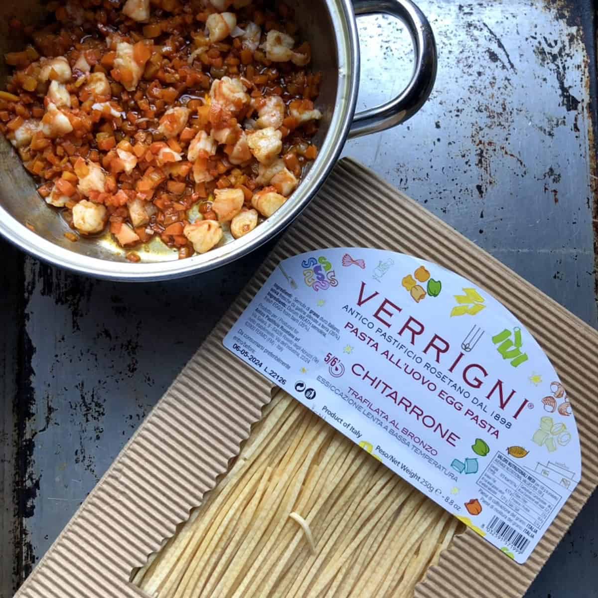 A package of Verrigni chitarroni artisanal small chitarra pasta from Roseto degli Abruzzo Italy, what is spaghetti alla chitarra and its variations.
