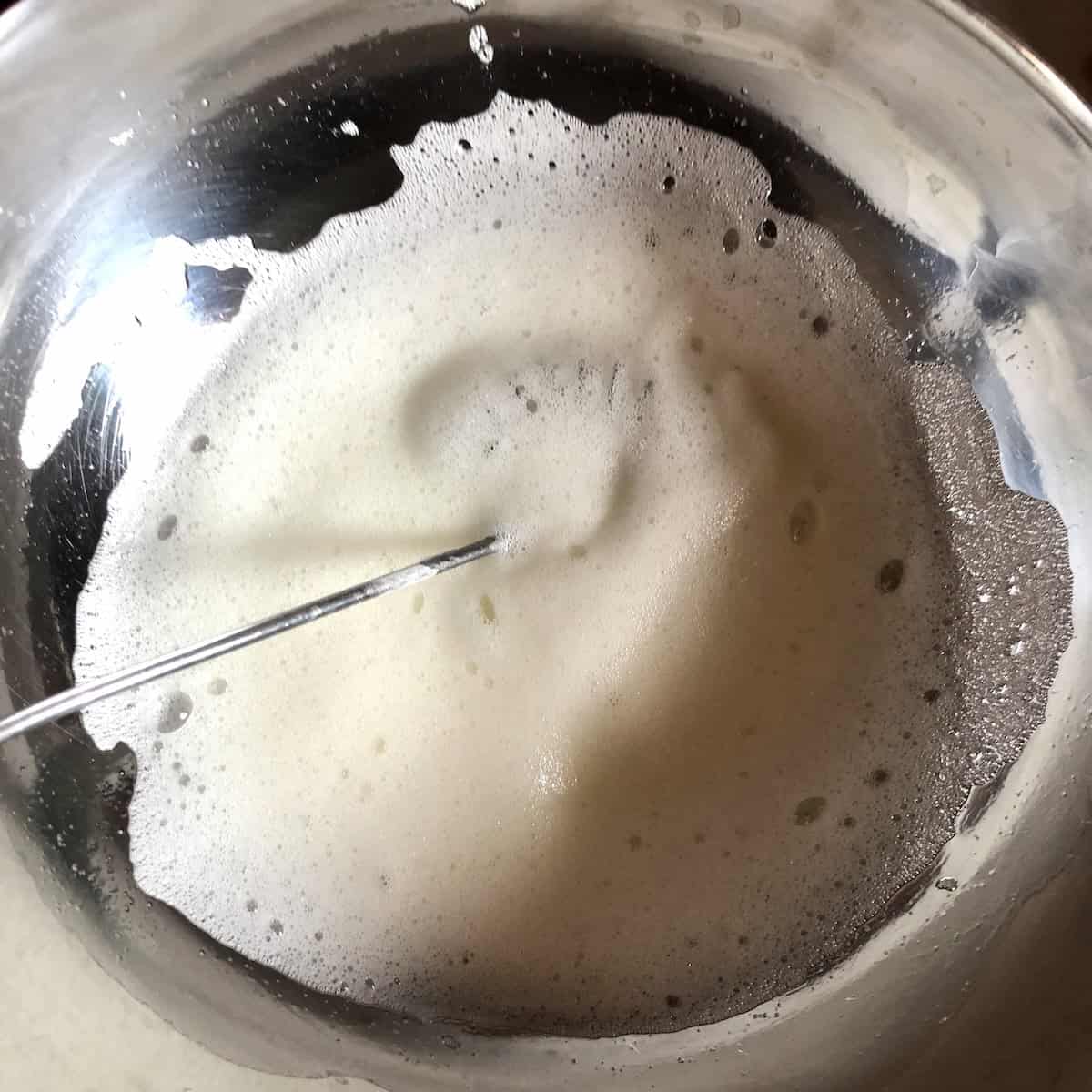 hipping egg whites to soft peaks for light and fluffy pumpkin pancakes recipe showing essential technique for making the best fluffy pumpkin pancakes from scratch.