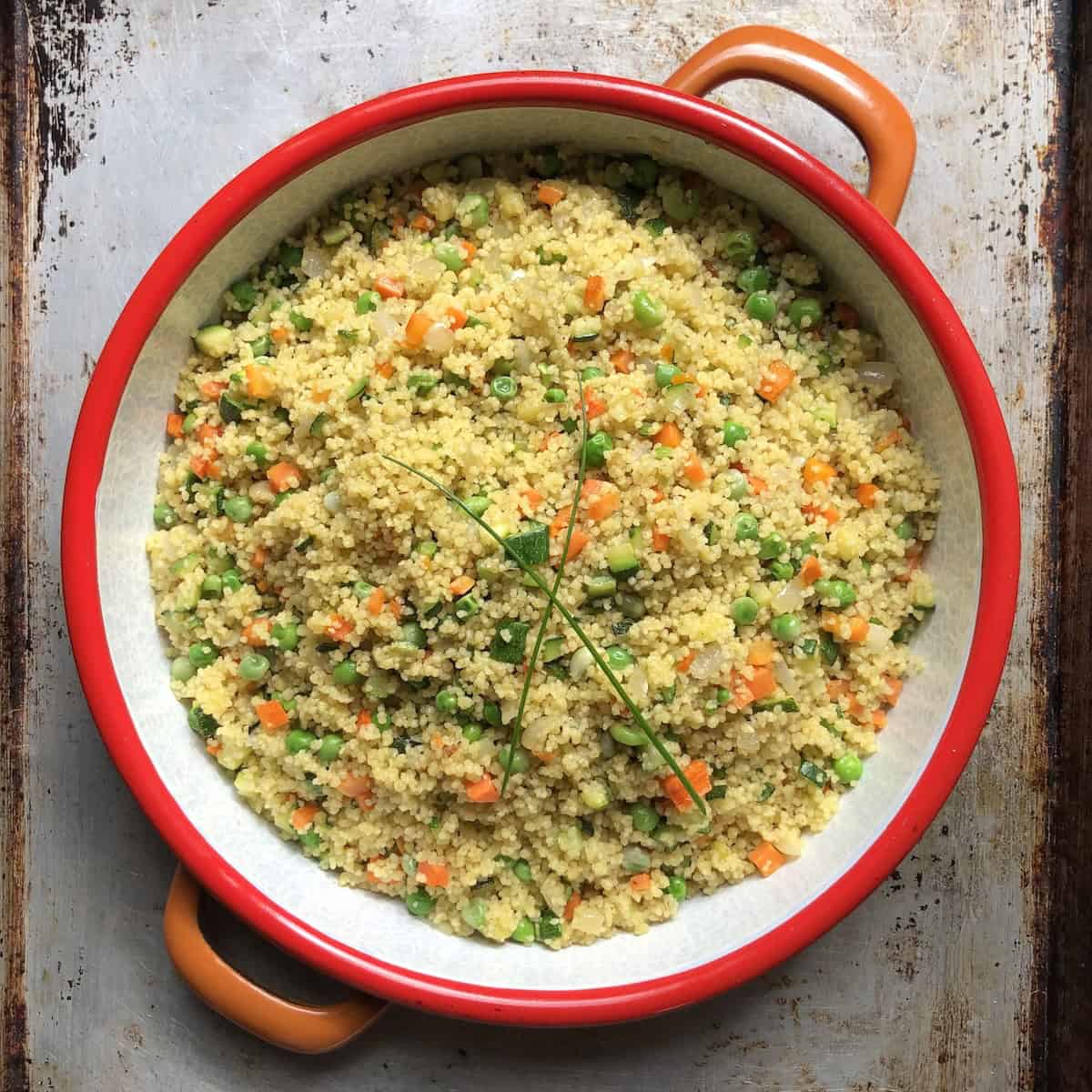 A serving dish filled with couscous salad made the authentic Mediterranean way.