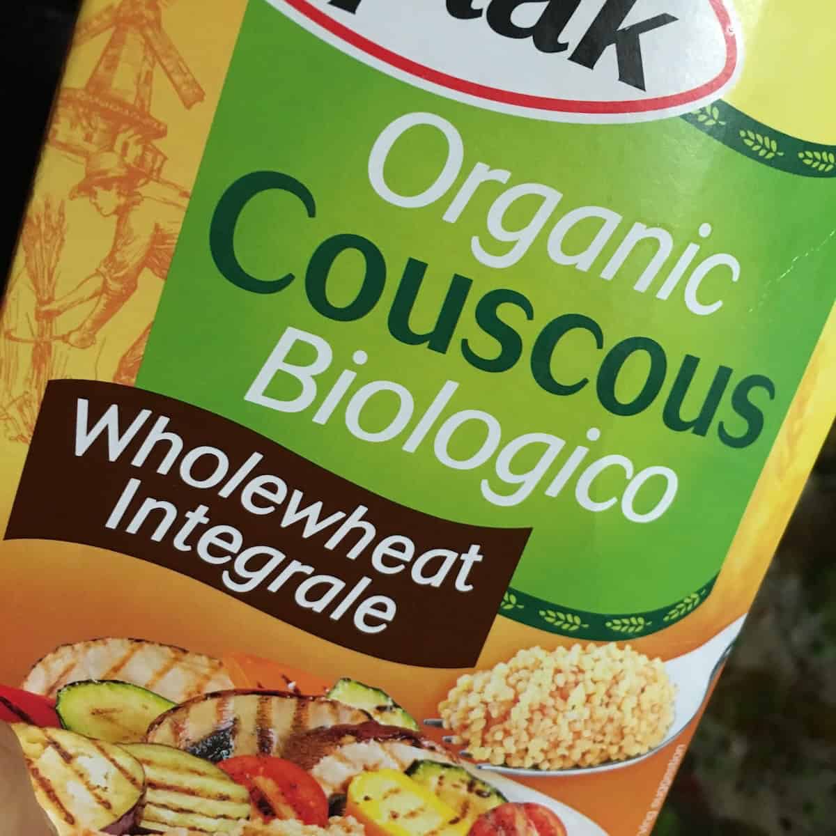 Organic whole wheat couscous box showing a healthy substitute option for authentic Italian Mediterranean vegetable couscous recipe, perfect for those seeking a nutritious alternative with more fiber while maintaining the same delicious Mediterranean flavors.