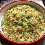 Mediterranean couscous up close shot showing glistening vegetables ready to be served.