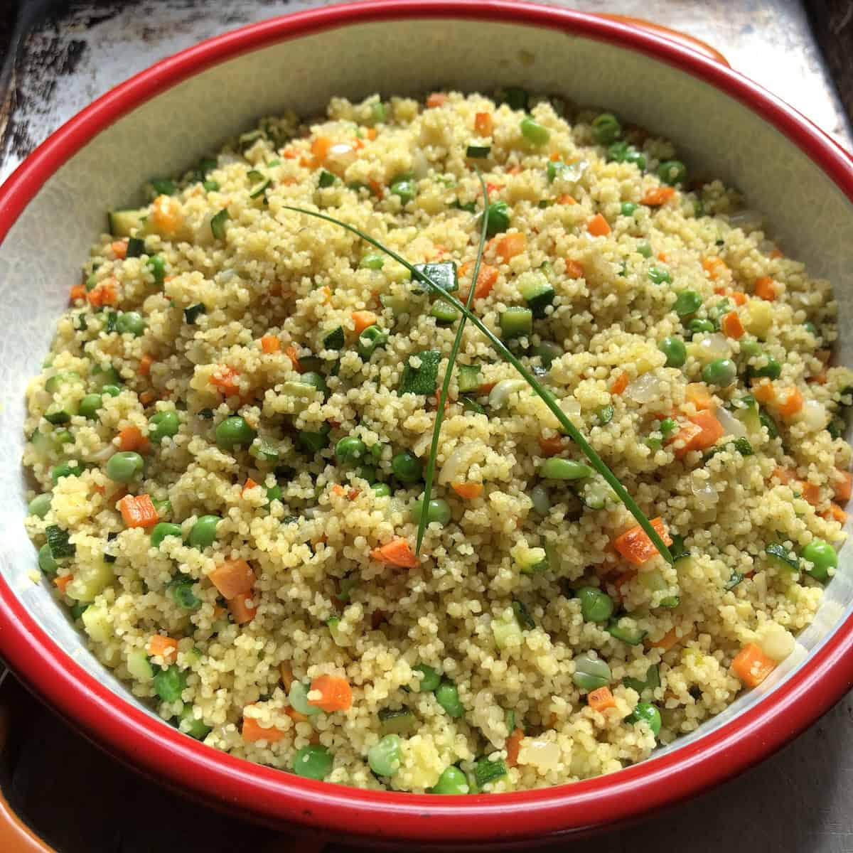Mediterranean couscous up close shot showing glistening vegetables ready to be served.