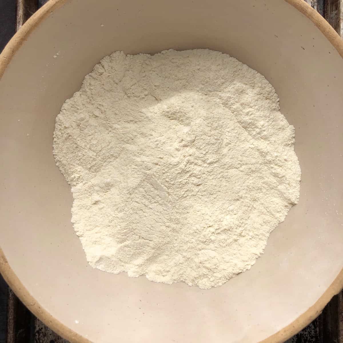 How to make pumpkin pasta dough whisking flour mixture for homemade pumpkin pasta recipe.