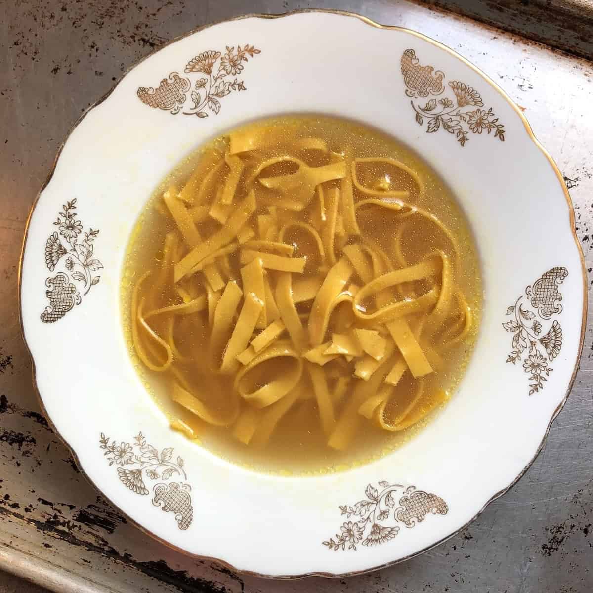 Pumpkin pasta soup with homemade pumpkin noodles in homemade chicken broth (unique pumpkin soup recipe with fresh pumpkin fettuccin
e noodles).