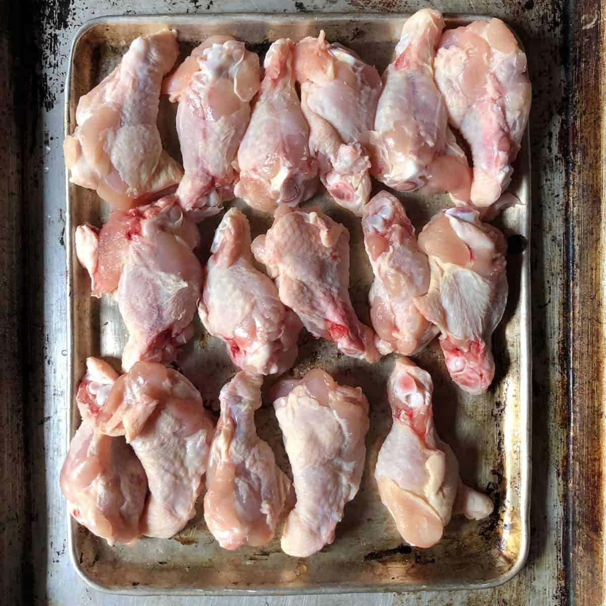 
Tray of raw chicken wingettes and drummettes for making buffalo wings or homemade chicken stock with collagen rich wing bones.
