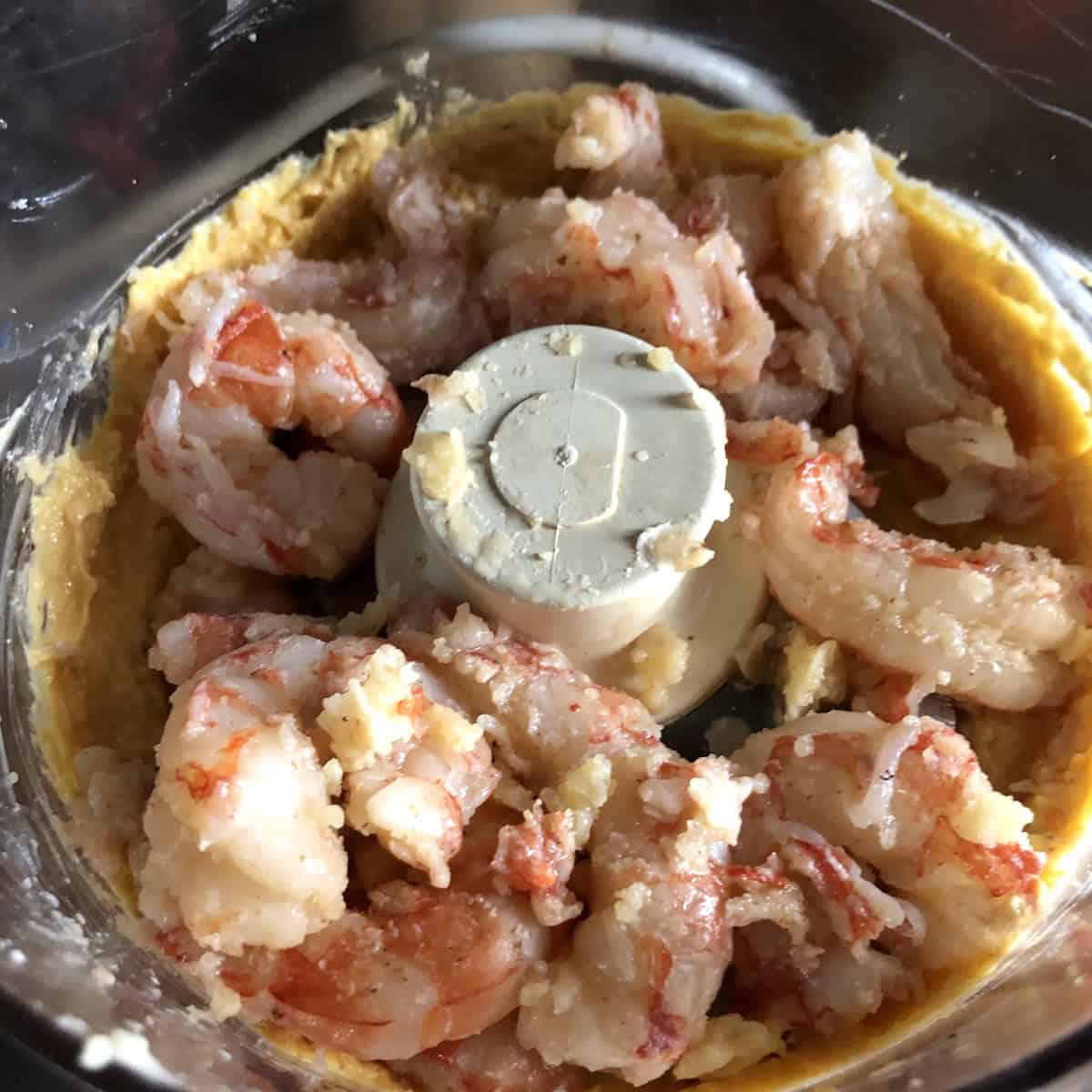 Par-cooked Argentinian red shrimp added to carrot mixture in food processor before pureeing for lobster ravioli filling shrimp mousse.

