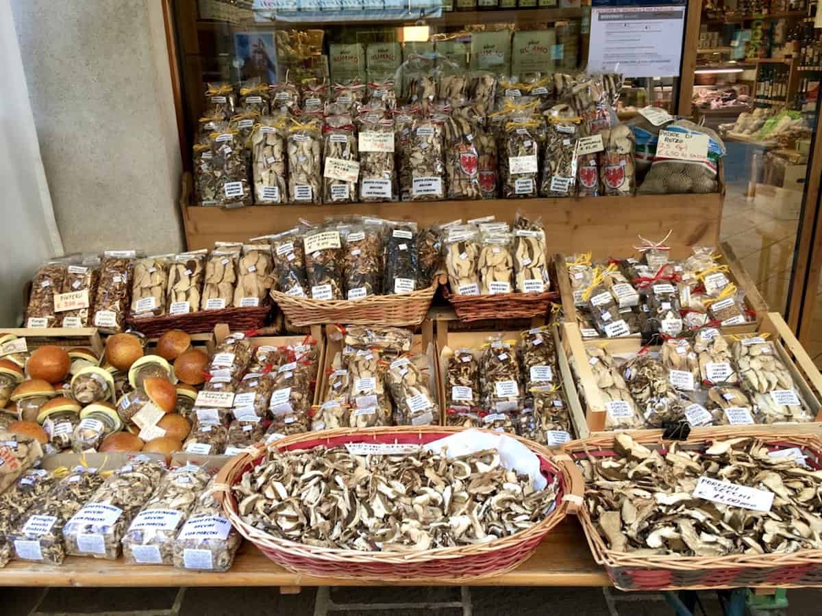 Fresh porcini mushroom display at a market in Asiago, Italy, used for making risotto, ravioli, and authentic pasta ai funghi.
