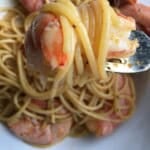 Cajun royal red shrimp tossed with spaghetti pasta in a spicy seasoned sauce, showing bright red gulf royal red shrimp over al dente spaghetti. A bold and flavorful lenten seafood pasta dinner.