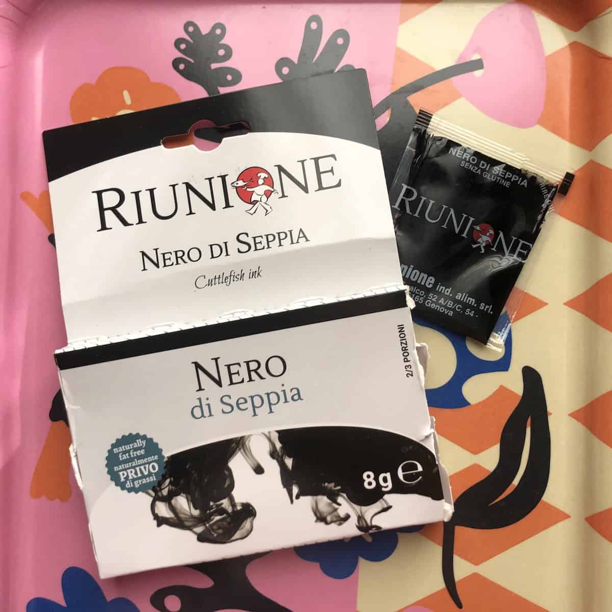 Riunione nero di seppia cuttlefish ink package front with 4g plastic sachet, where to buy squid ink for homemade black pasta recipe.
