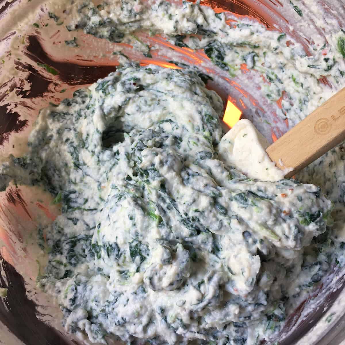 Spinach and ricotta ravioli filling without egg but with more ricotta added, showing how the extra ricotta affects the texture and consistency of the filling.