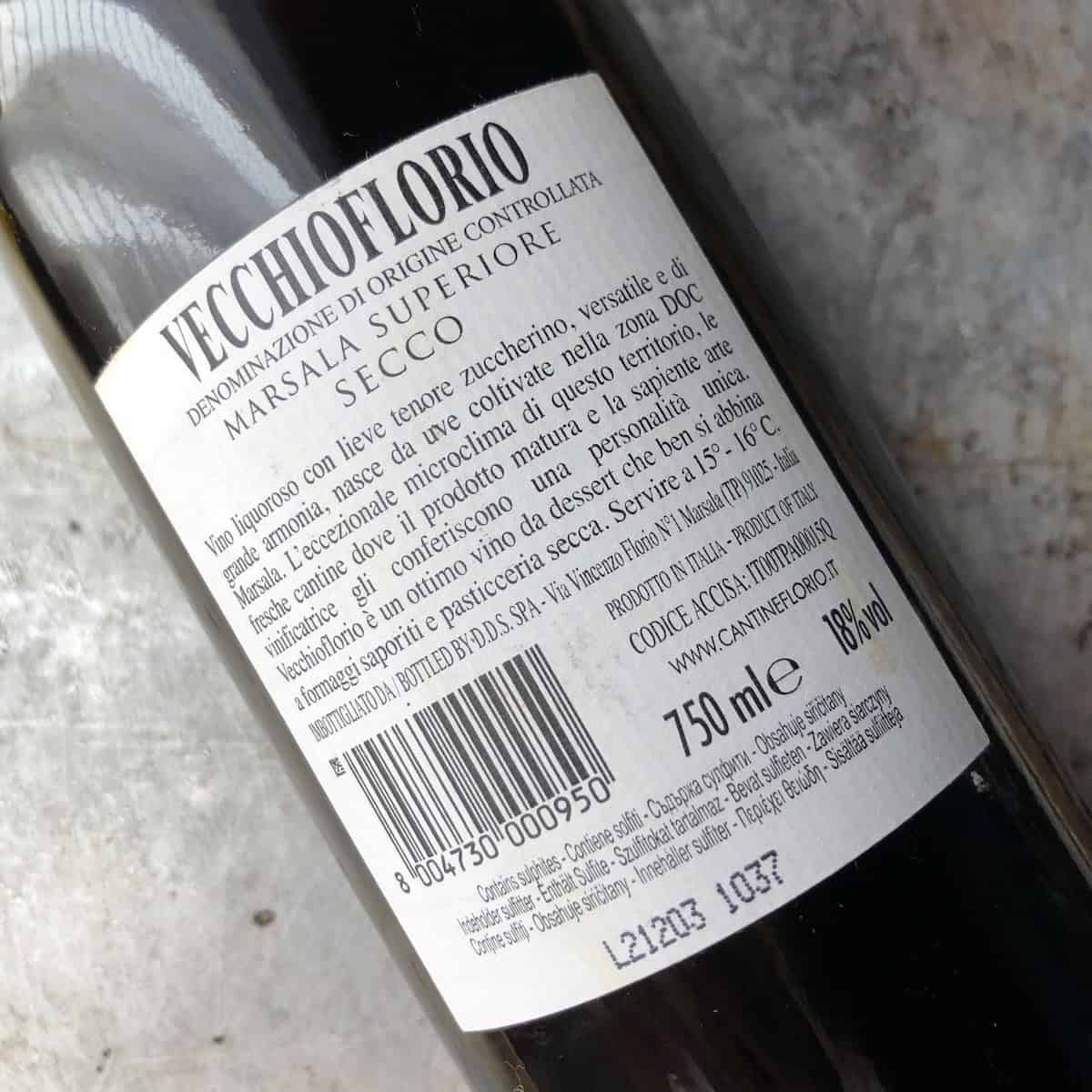 Back label of Cantina Florio Vecchioflorio Marsala Superiore Secco showing 18 percent alcohol DOC, ideal marsala for tiramisu.
