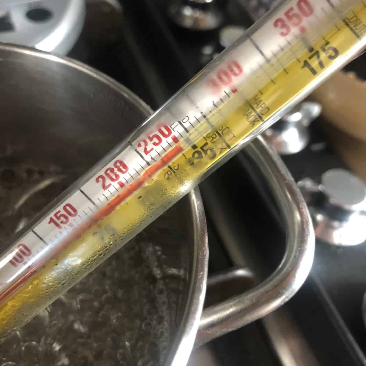 Candy thermometer reading 250 F or 121 C for sugar syrup to make sabayon (pasteurized) for tiramisu.