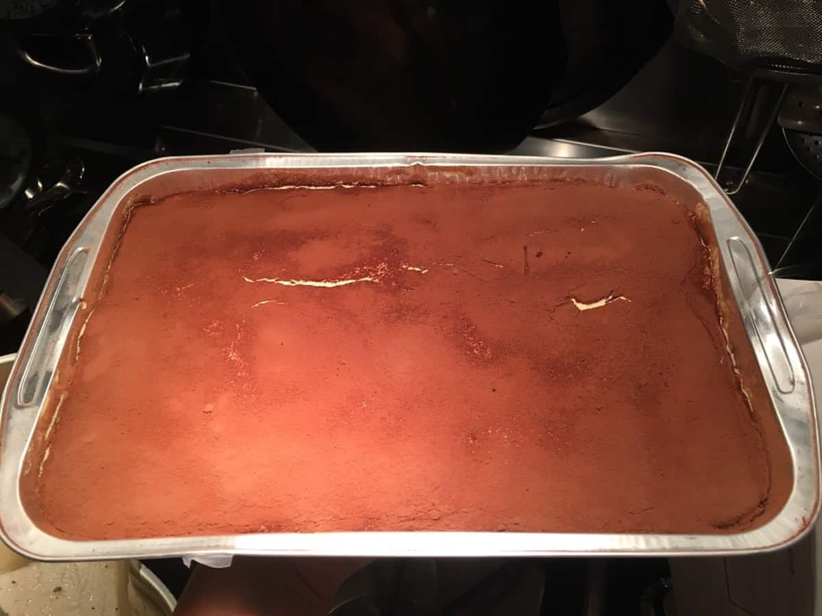 Tiramisu in a disposable aluminum tin easy to transport for summer parties, barbecues, and potlucks.