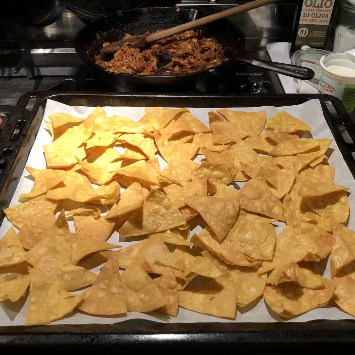 Tray of homemade freshly fried yellow corn tortilla chips for chips and guacamole.
