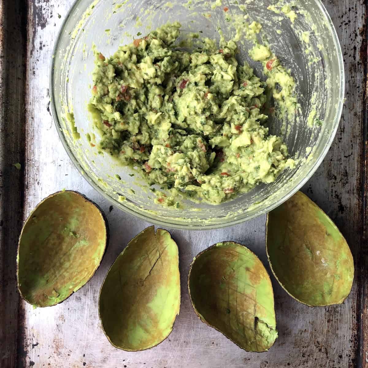Combined and finished fresh guacamole in a bowl ready to serve.
