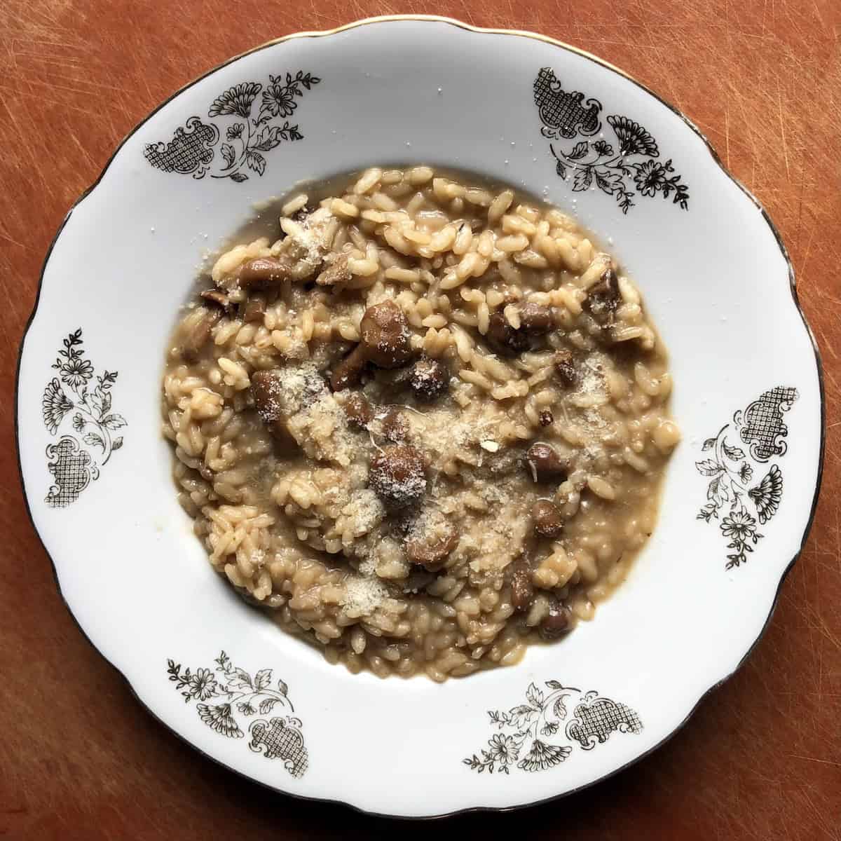 Pantry porcini mushroom risotto made with Italian seasoned canned mushrooms in oil and rehydrated dried porcini mushrooms, dried porcini mushroom risotto recipe for a quick creamy risotto from pantry ingredients.
