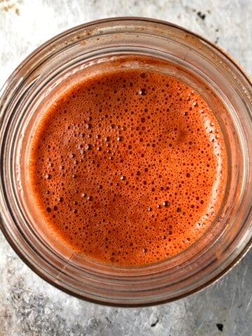 Top down view of finished marinade for pollo asado in a glass ball canning jar ready to use or store.