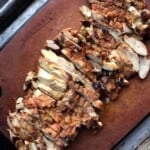 Finely diced pollo asado al carbon on an Epicurean cutting board ready for tacos, enchiladas, taquitos, and flautas.