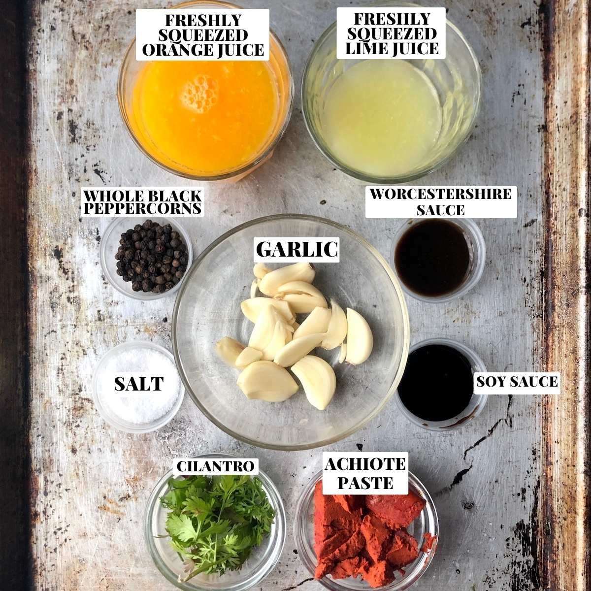 Labeled pollo asado marinade ingredients on a cutting board, mexican chicken marinade made from scratch.