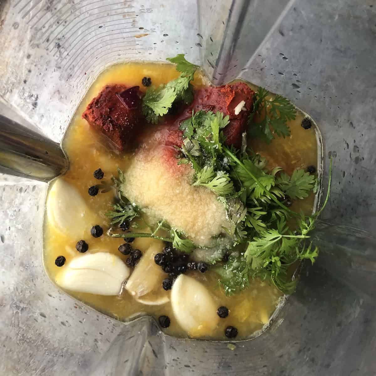 Pollo asado marinade recipe ingredients added to a Vitamix blender ready to puree.