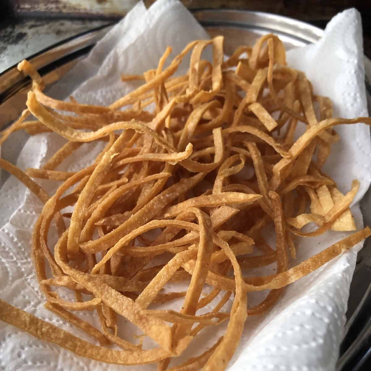 Perfectly golden brown fried tortilla strips for chicken tortilla soup.
