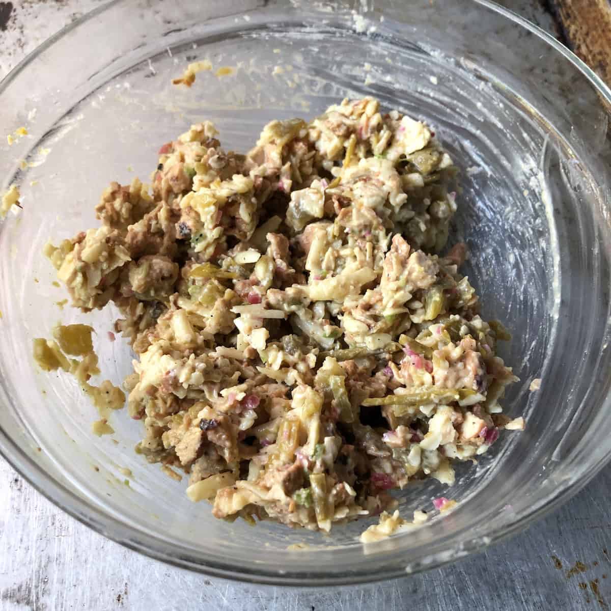 Chicken flautas filling combined and bound together in a mixing bowl ready to fill the tortillas.
